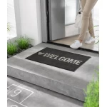 Durvju paklājs Kleen-Tex Wash+Dry Warmly Welcome 1